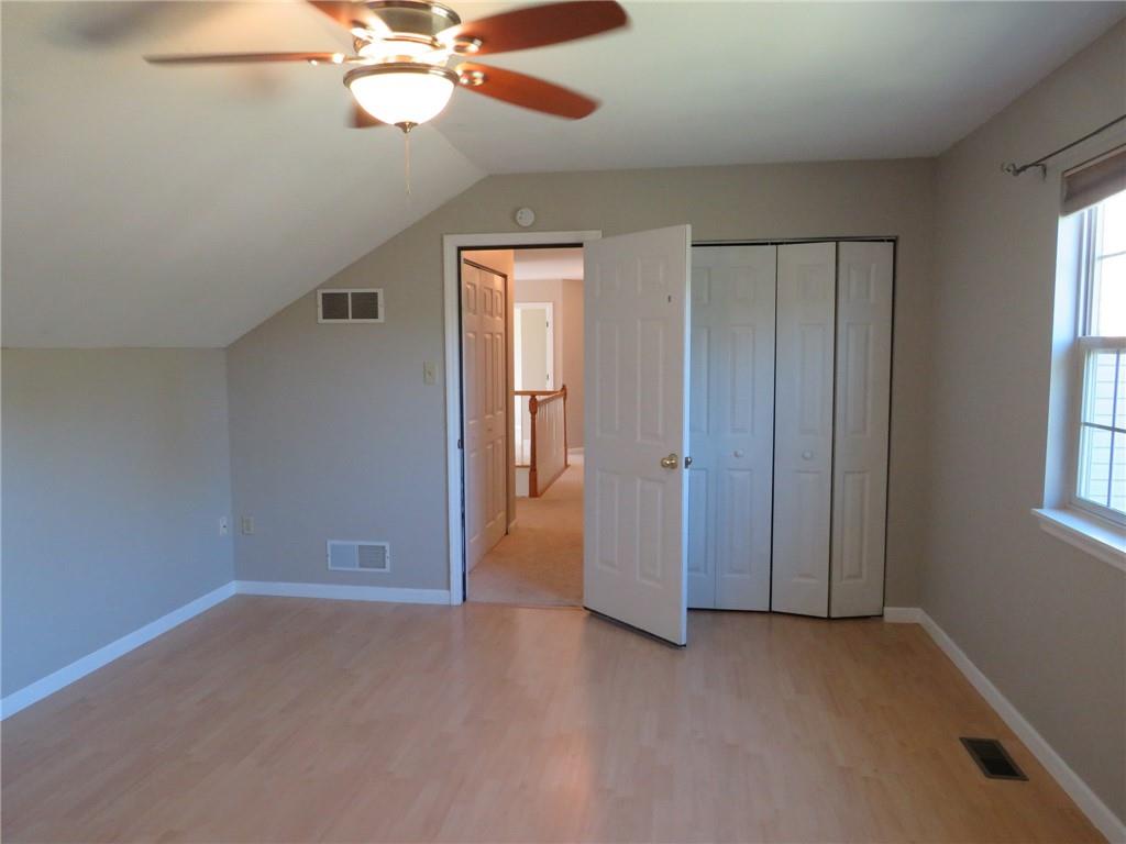 6755 Old Mars Crider Road Seven Fields, PA 16046 - Photo 29 of 50 an empty room with closet and a chandelier fan