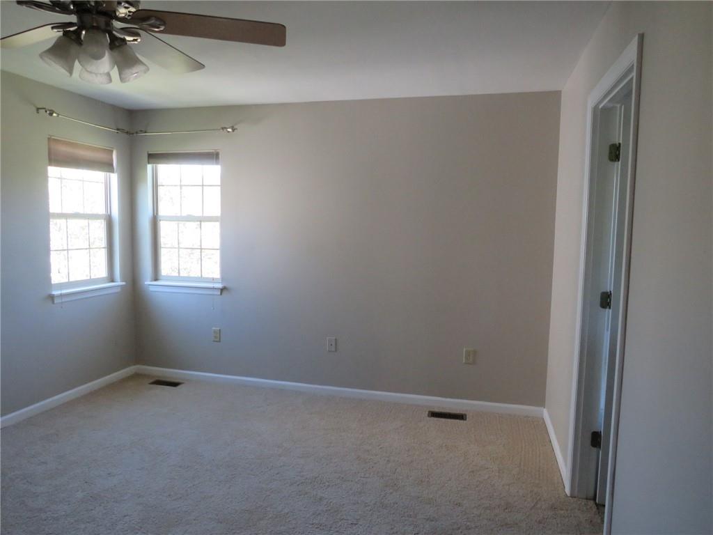 6755 Old Mars Crider Road Seven Fields, PA 16046 - Photo 31 of 50 an empty room with a window and a fan