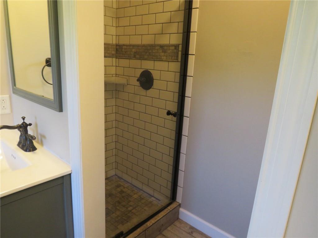 6755 Old Mars Crider Road Seven Fields, PA 16046 - Photo 37 of 50 a bathroom with a sink and a mirror