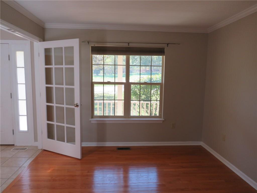 6755 Old Mars Crider Road Seven Fields, PA 16046 - Photo 6 of 50 an empty room with wooden floor and windows