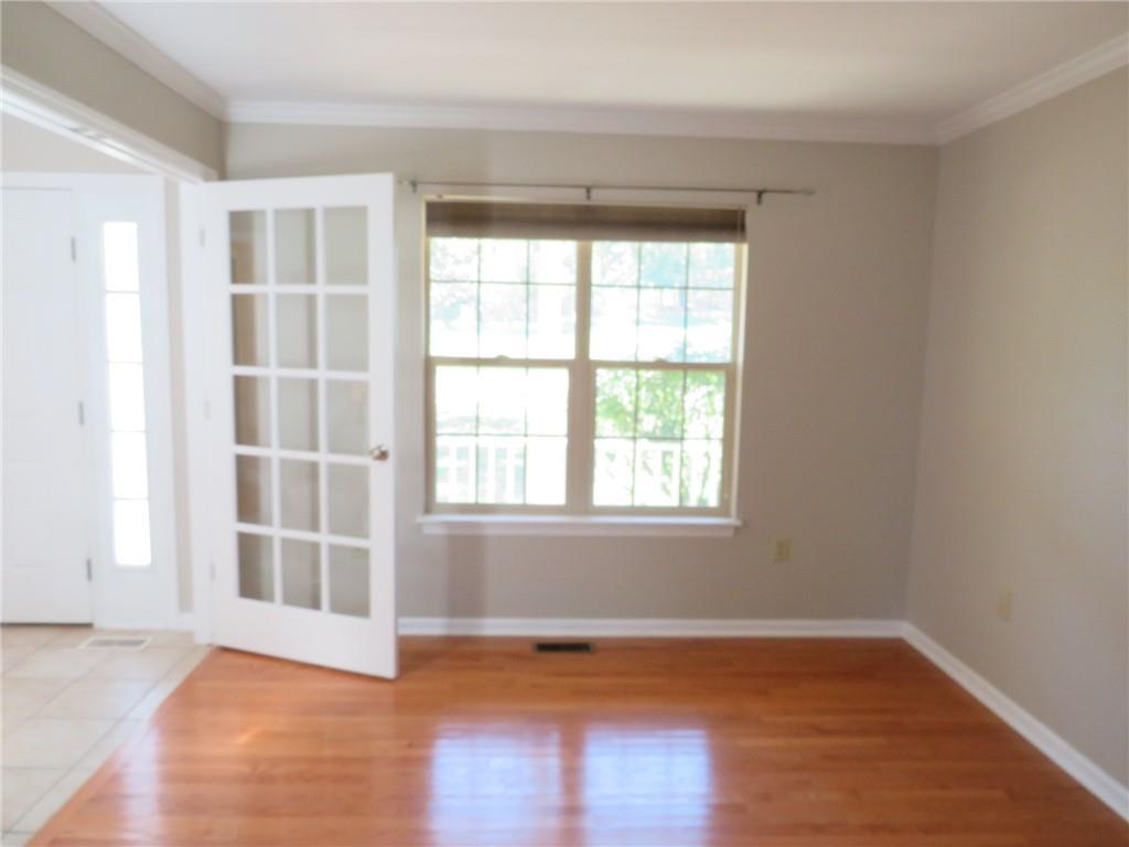 6755 Old Mars Crider Road Seven Fields, PA 16046 - Photo 8 of 50 an empty room with wooden floor and windows