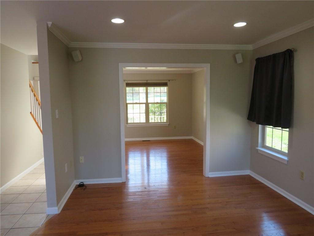 6755 Old Mars Crider Road Seven Fields, PA 16046 - Photo 10 of 50 a view of an empty room with wooden floor and a window