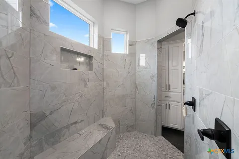 a bathroom with a shower and a toilet