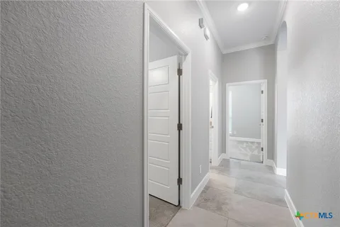 wooden floor with a bathroom view