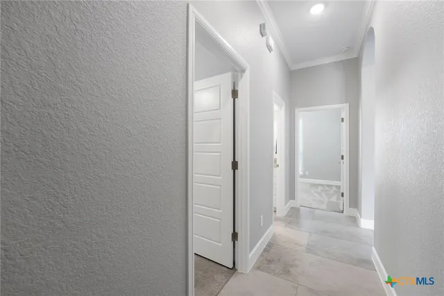 wooden floor with a bathroom view