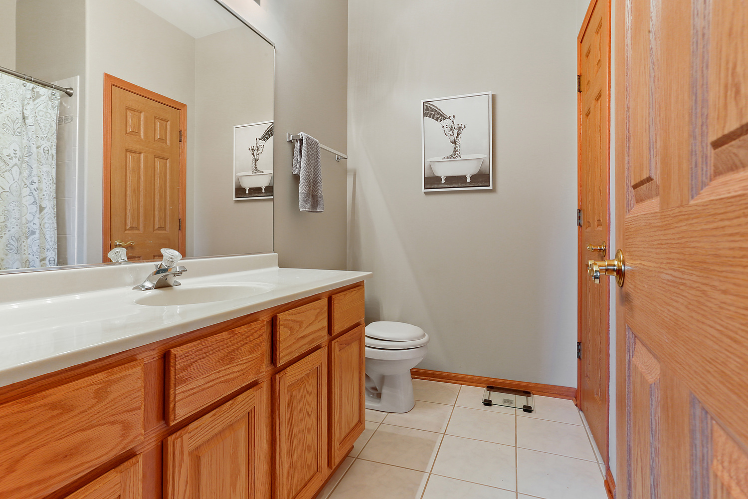 18133 Eagle Drive Tinley Park, IL 60477 - Photo 12 of 20 a bathroom with a granite countertop sink toilet and shower
