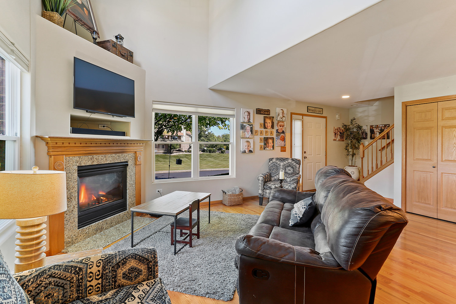 18133 Eagle Drive Tinley Park, IL 60477 - Photo 3 of 20 a living room with furniture fireplace and flat screen tv