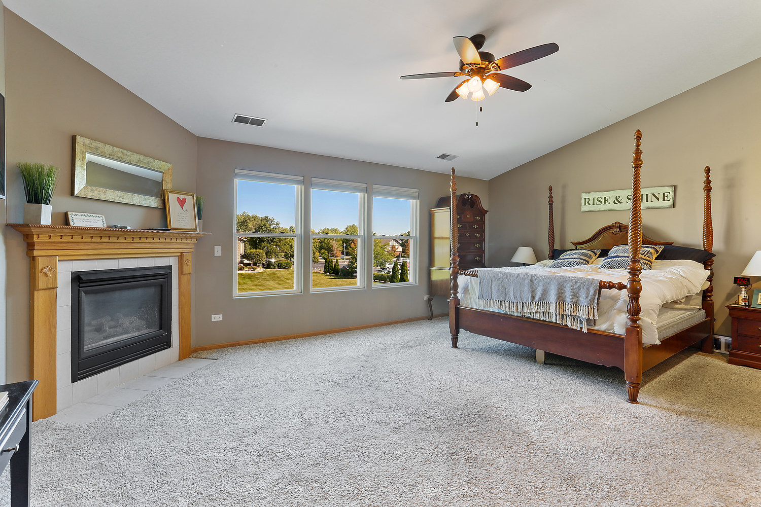 18133 Eagle Drive Tinley Park, IL 60477 - Photo 7 of 20 a bedroom with a bed and a fireplace