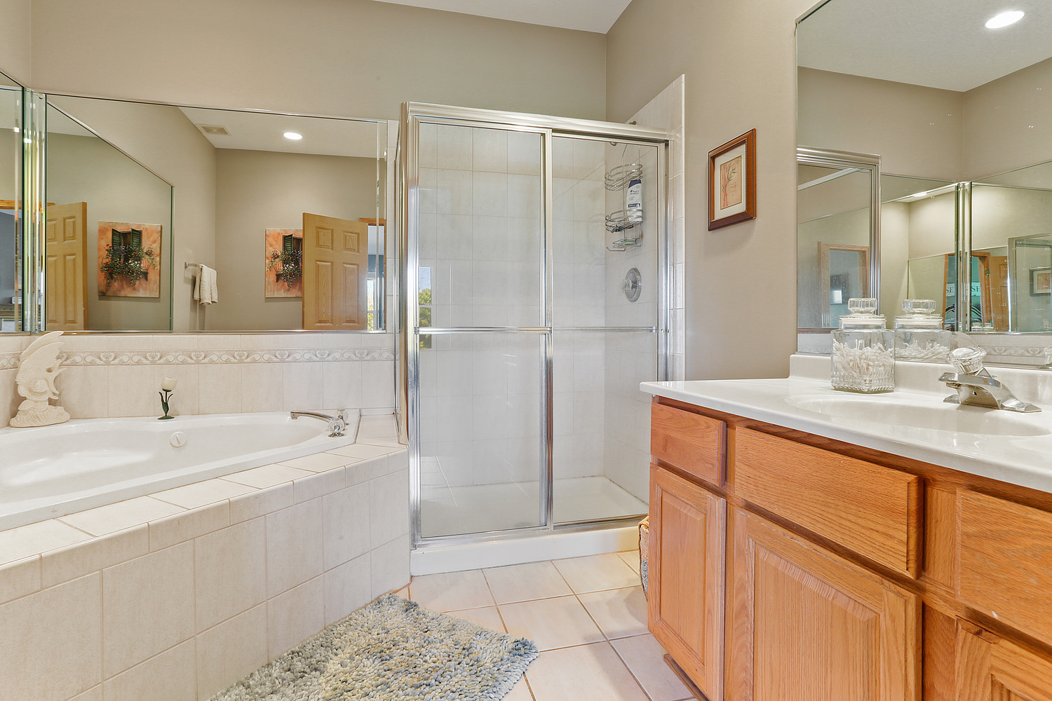 18133 Eagle Drive Tinley Park, IL 60477 - Photo 8 of 20 a bathroom with a double vanity sink mirror and shower