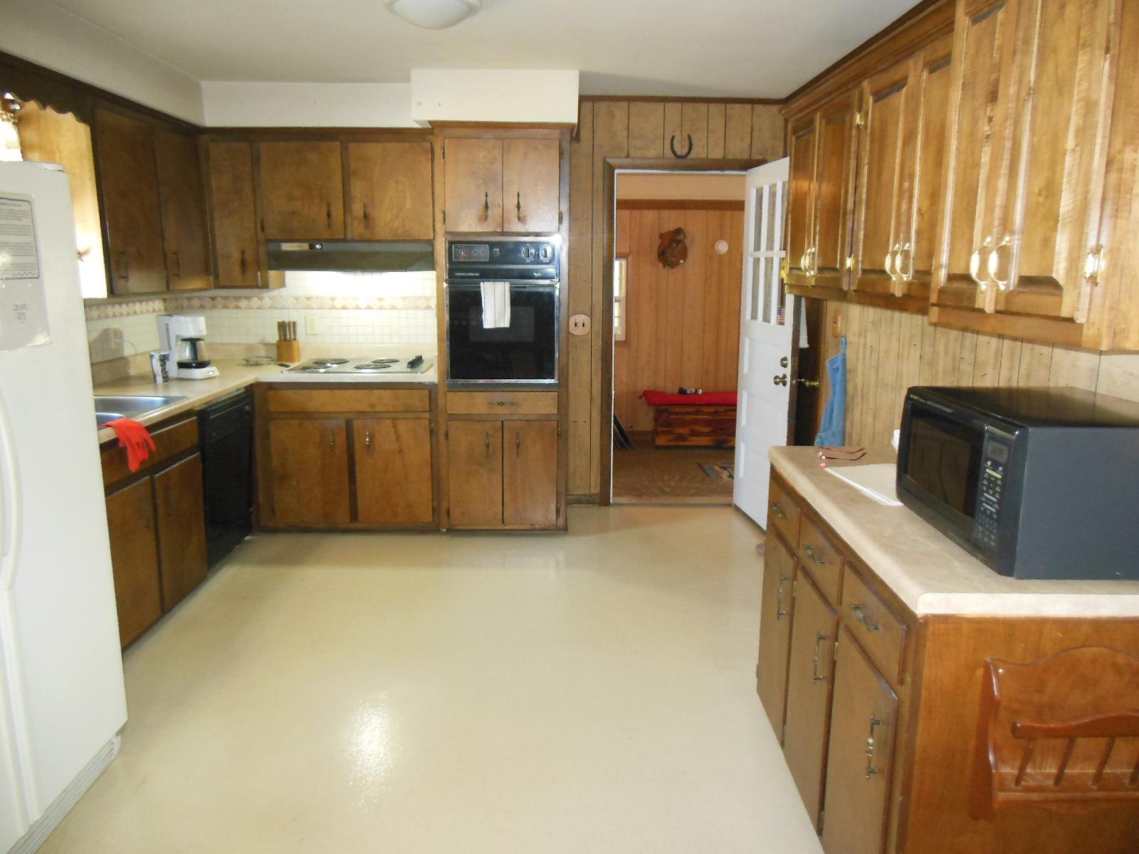 3458 Ott Wilson Road Springfield, TN 37172 - Photo 3 of 19 a kitchen with stainless steel appliances granite countertop a stove a sink and a refrigerator