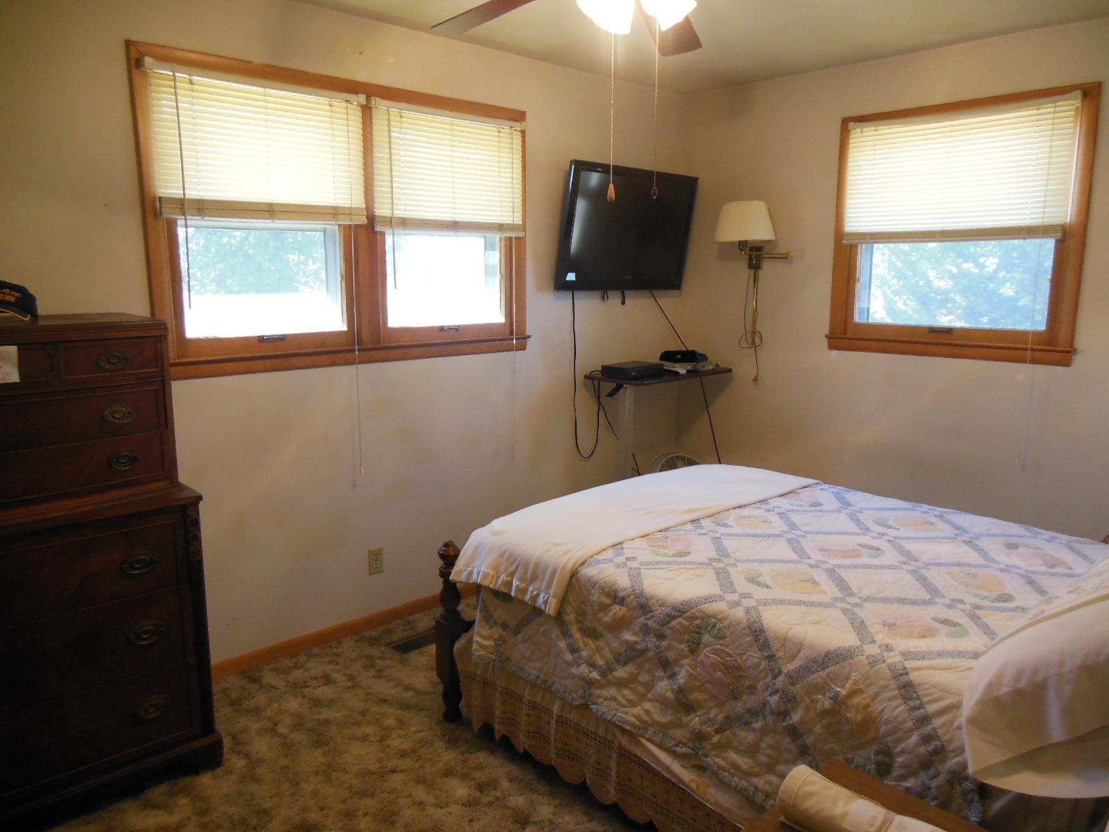 3458 Ott Wilson Road Springfield, TN 37172 - Photo 8 of 19 a bedroom with a bed and a flat tv screen on the dresser