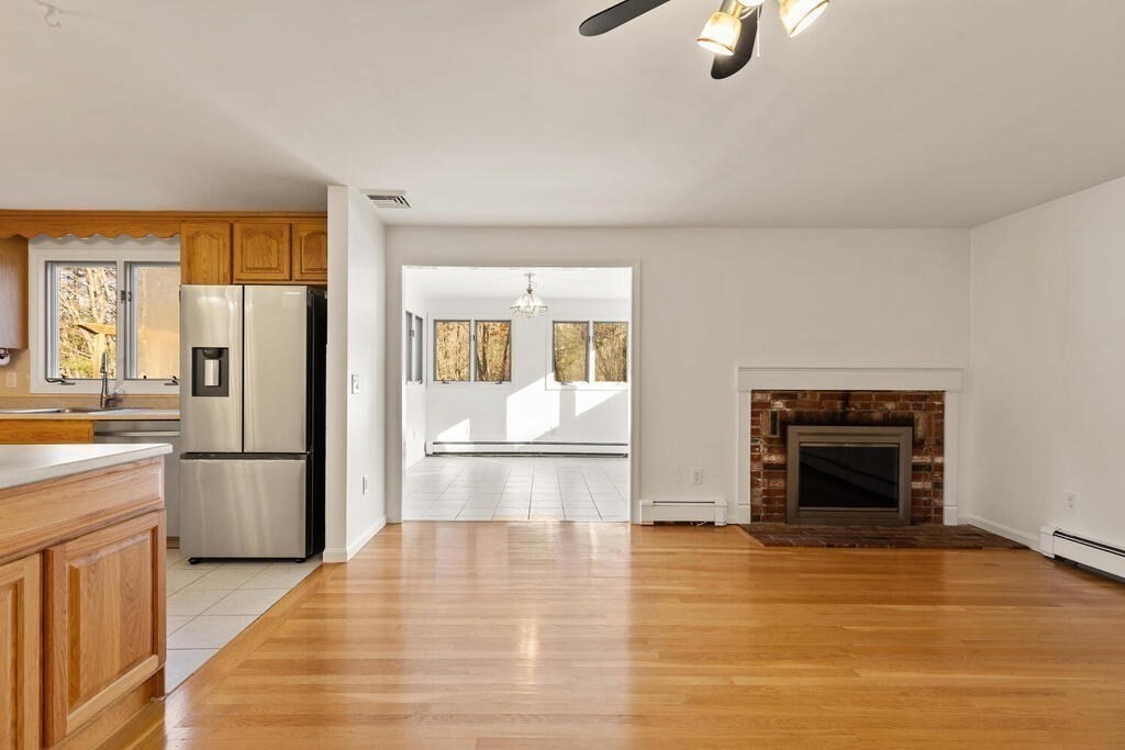 815 Great Road Stow, MA 01775 - Photo 12 of 32 a kitchen with a refrigerator and a stove