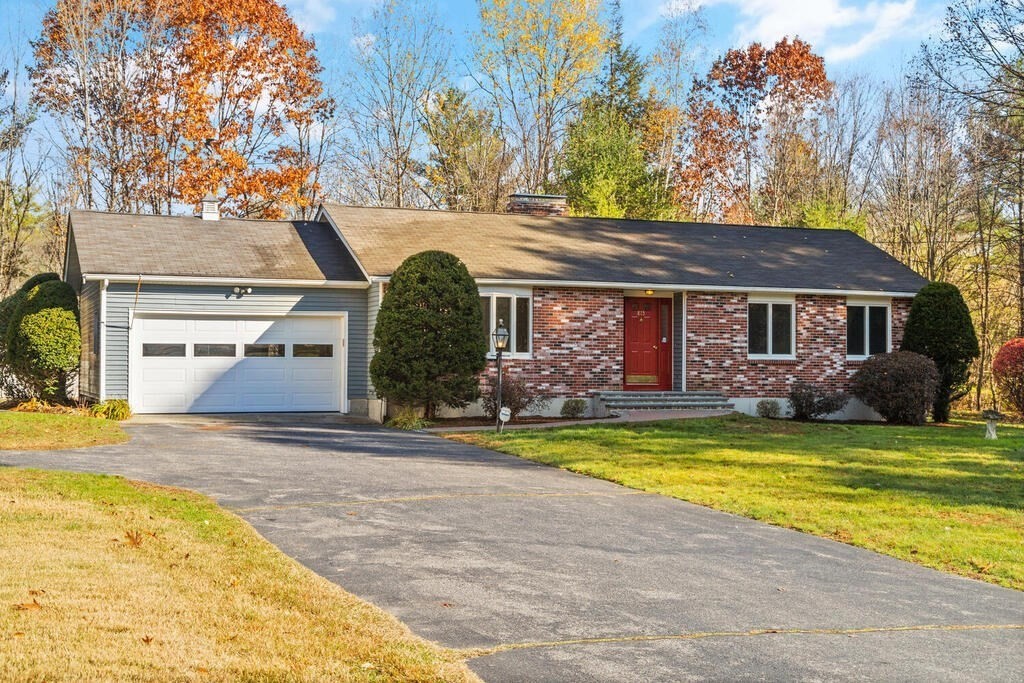 815 Great Road Stow, MA 01775 - Photo 2 of 32 a front view of a house with swimming pool and porch with furniture