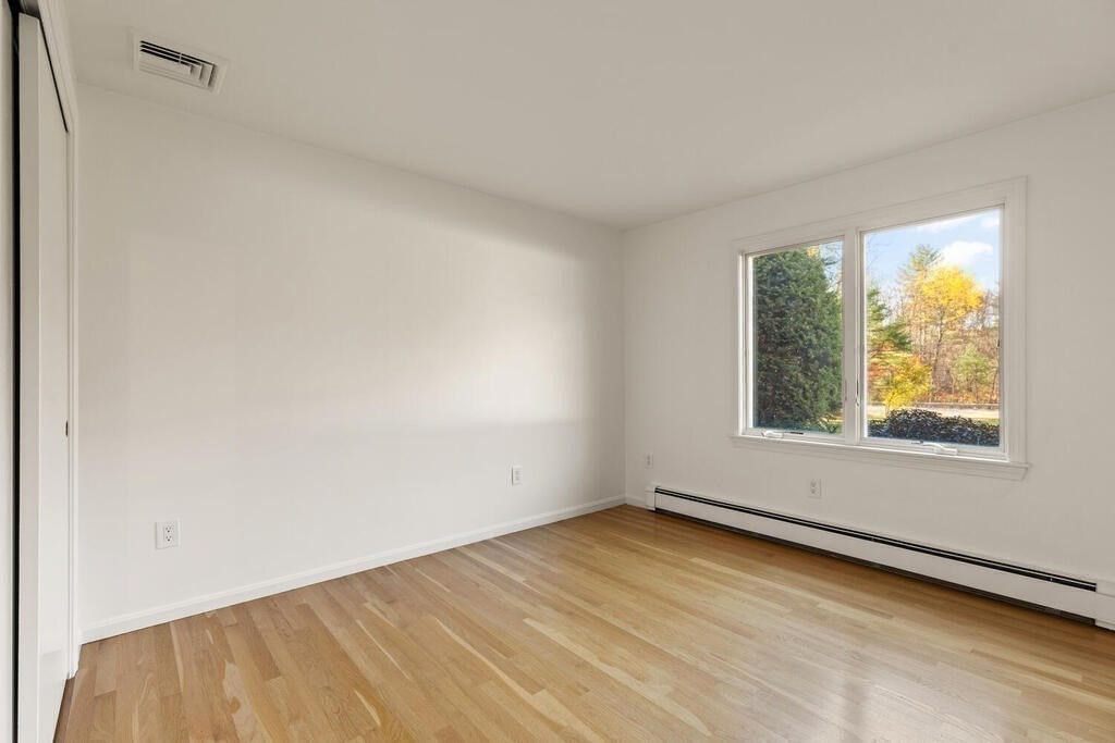 815 Great Road Stow, MA 01775 - Photo 22 of 32 an empty room with a window
