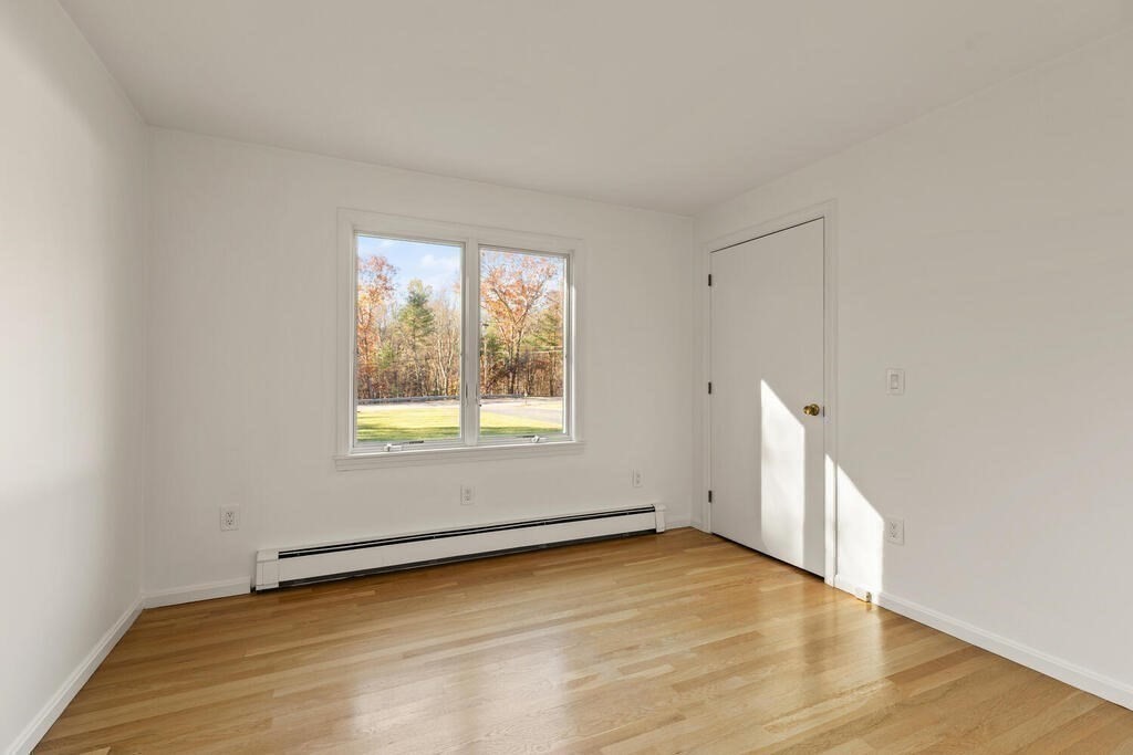 815 Great Road Stow, MA 01775 - Photo 24 of 32 an empty room with a window