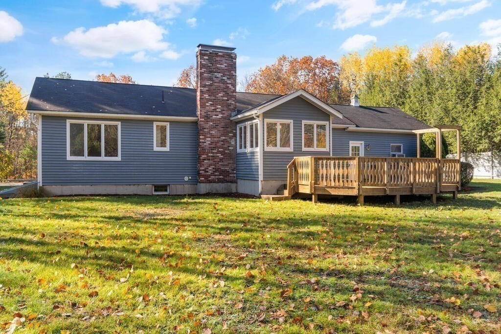815 Great Road Stow, MA 01775 - Photo 28 of 32 a front view of a house with a yard