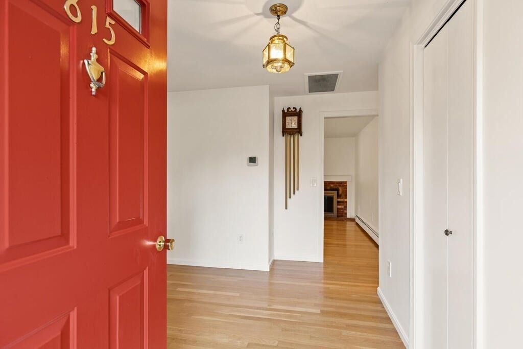 815 Great Road Stow, MA 01775 - Photo 3 of 32 a view of a hallway with wooden floor
