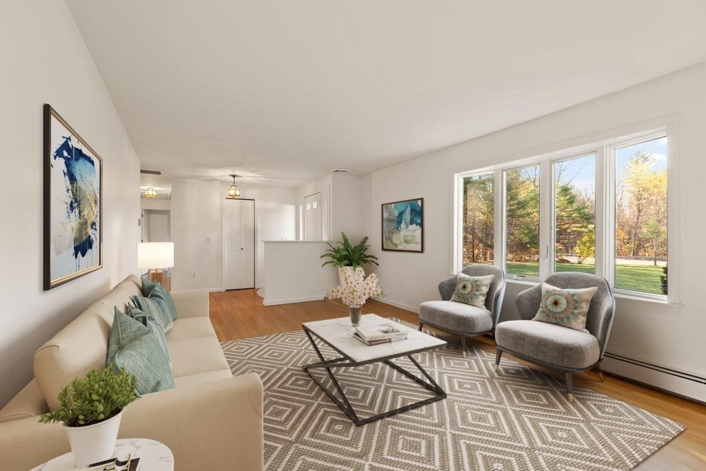 815 Great Road Stow, MA 01775 - Photo 5 of 32 a living room with furniture and a large window