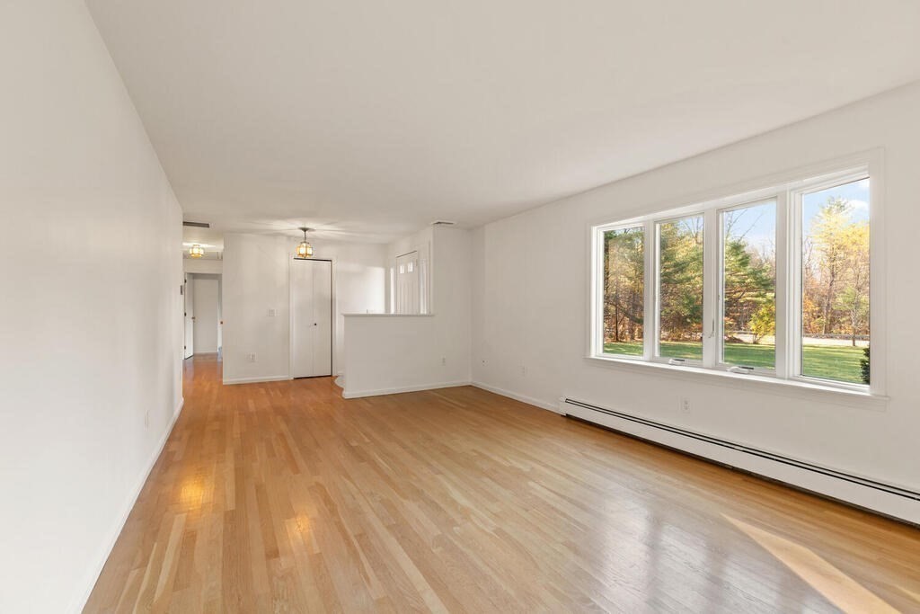 815 Great Road Stow, MA 01775 - Photo 6 of 32 a view of an empty room with a window