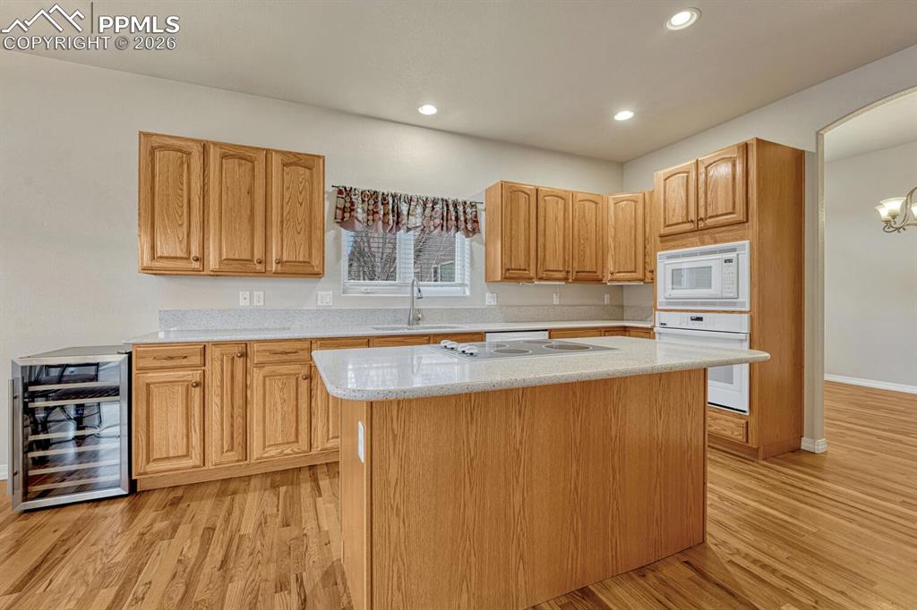 1665 Doe Run Point Colorado Springs, CO 80919 - Photo 12 of 49 a kitchen with stainless steel appliances granite countertop a stove a sink and a refrigerator