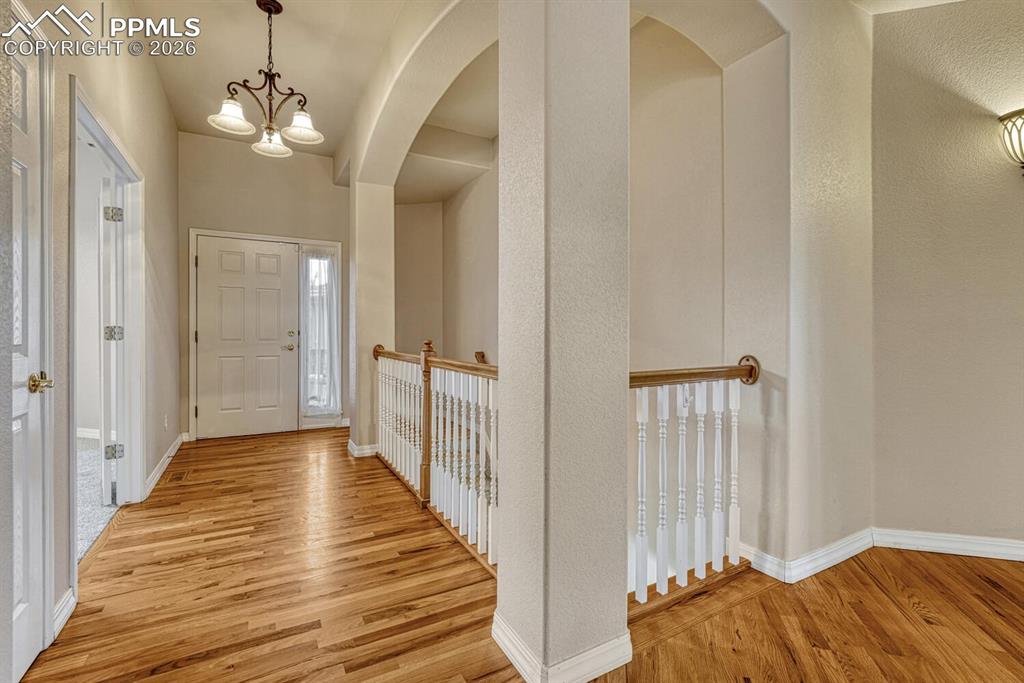 1665 Doe Run Point Colorado Springs, CO 80919 - Photo 4 of 49 a view of a bedroom from the hallway