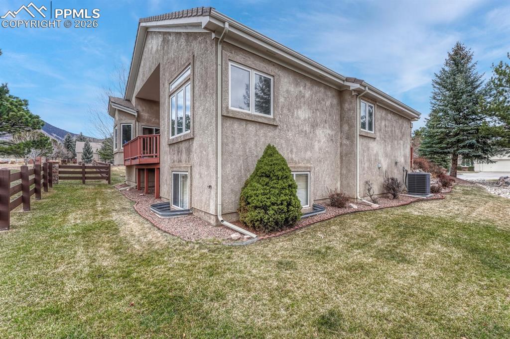 1665 Doe Run Point Colorado Springs, CO 80919 - Photo 44 of 49 a front view of a house with garden