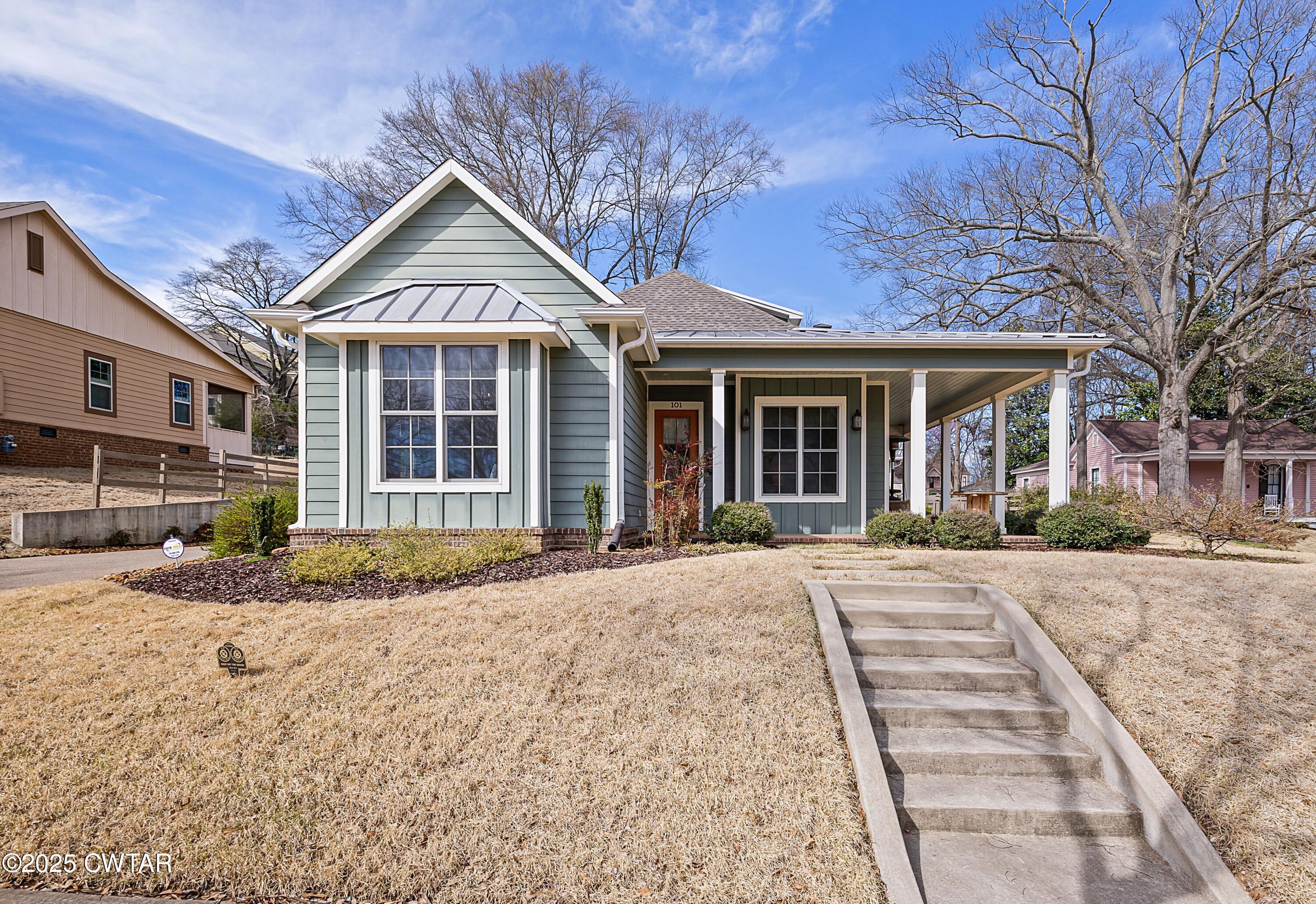 101 Morgan Street Jackson, TN 38301 - Photo 1 of 24 a front view of a house with a yard