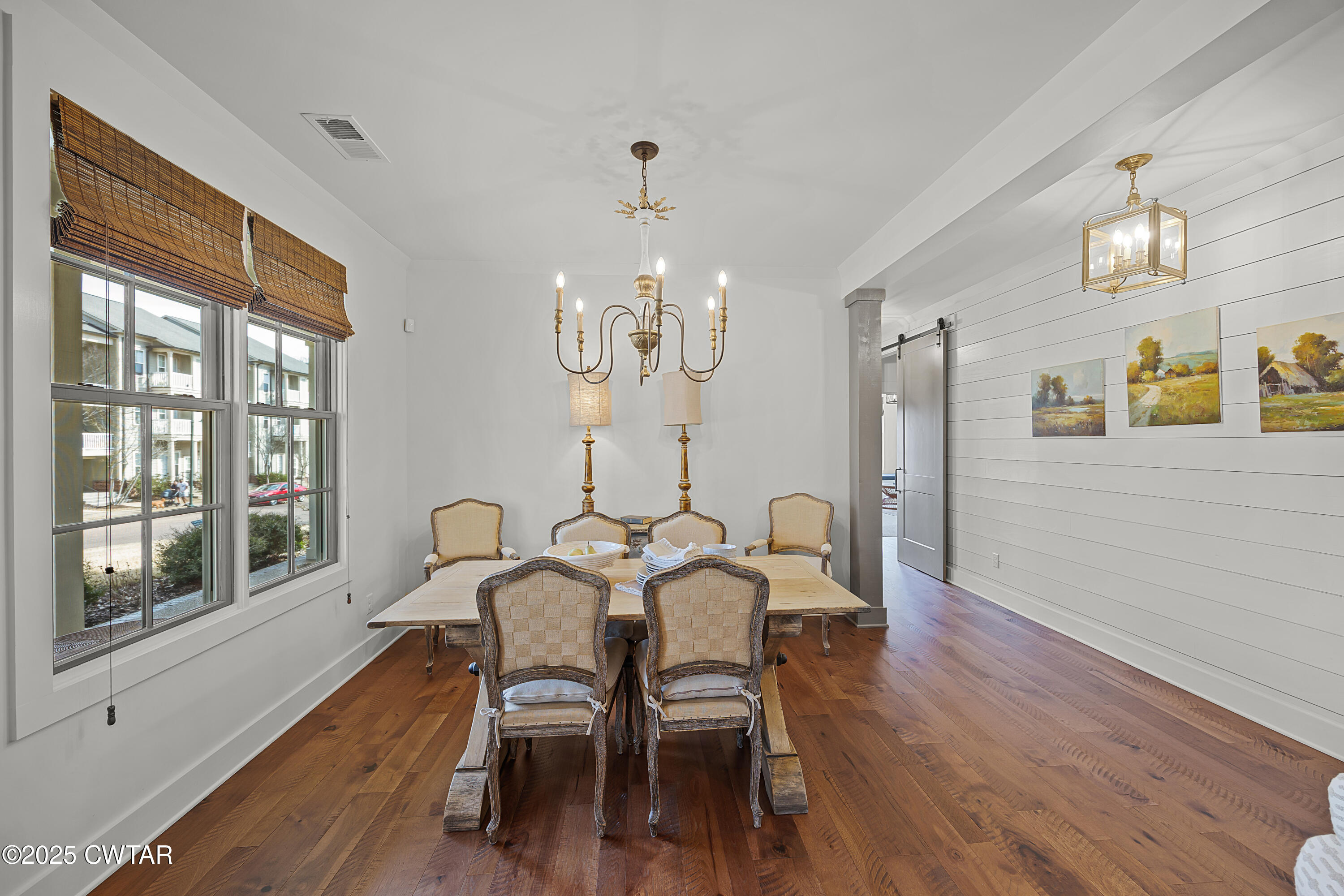 101 Morgan Street Jackson, TN 38301 - Photo 11 of 24 a view of a dining room with furniture a chandelier and wooden floor