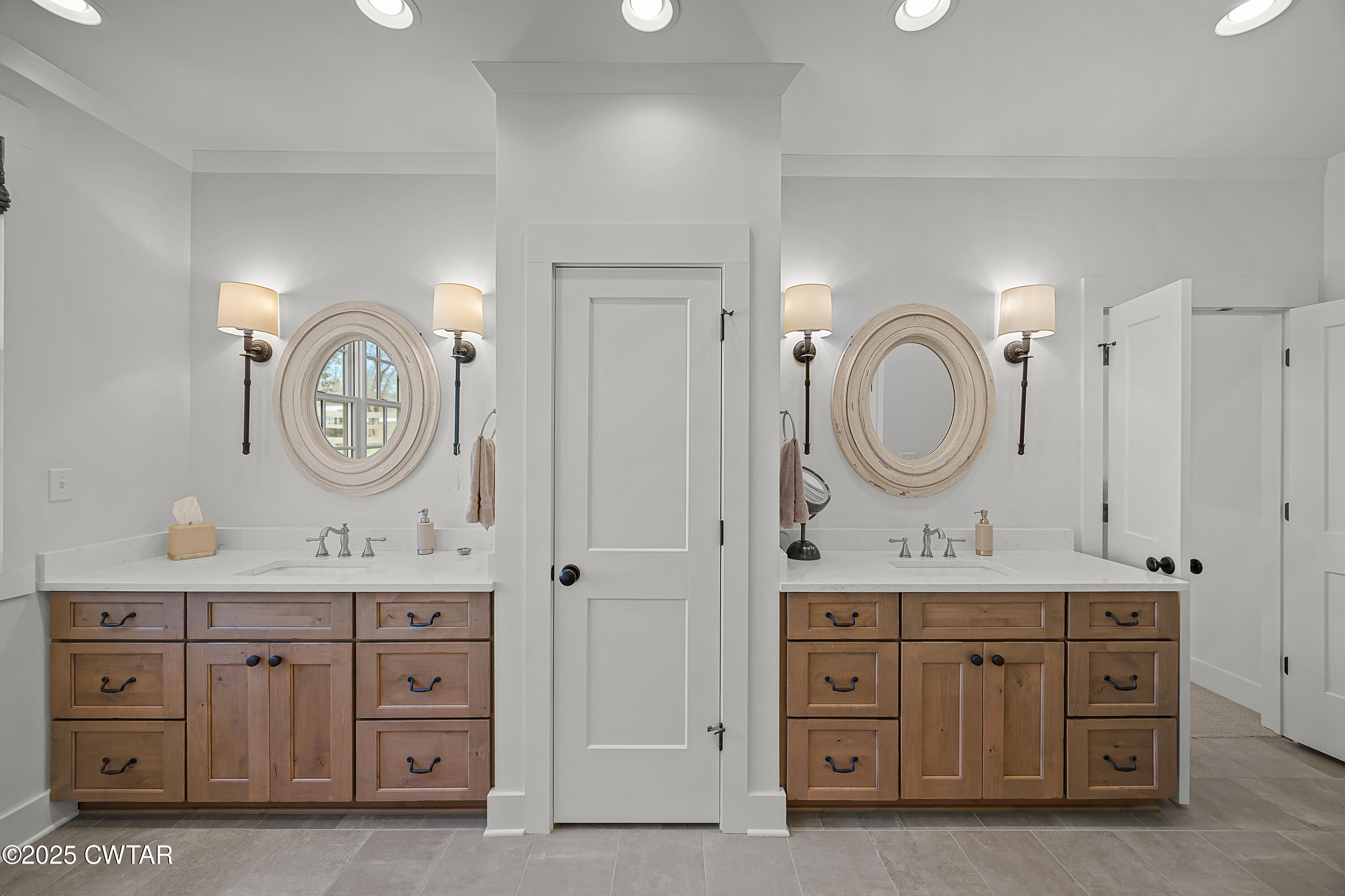 101 Morgan Street Jackson, TN 38301 - Photo 12 of 24 a spacious bathroom with a double vanity sink and a mirror