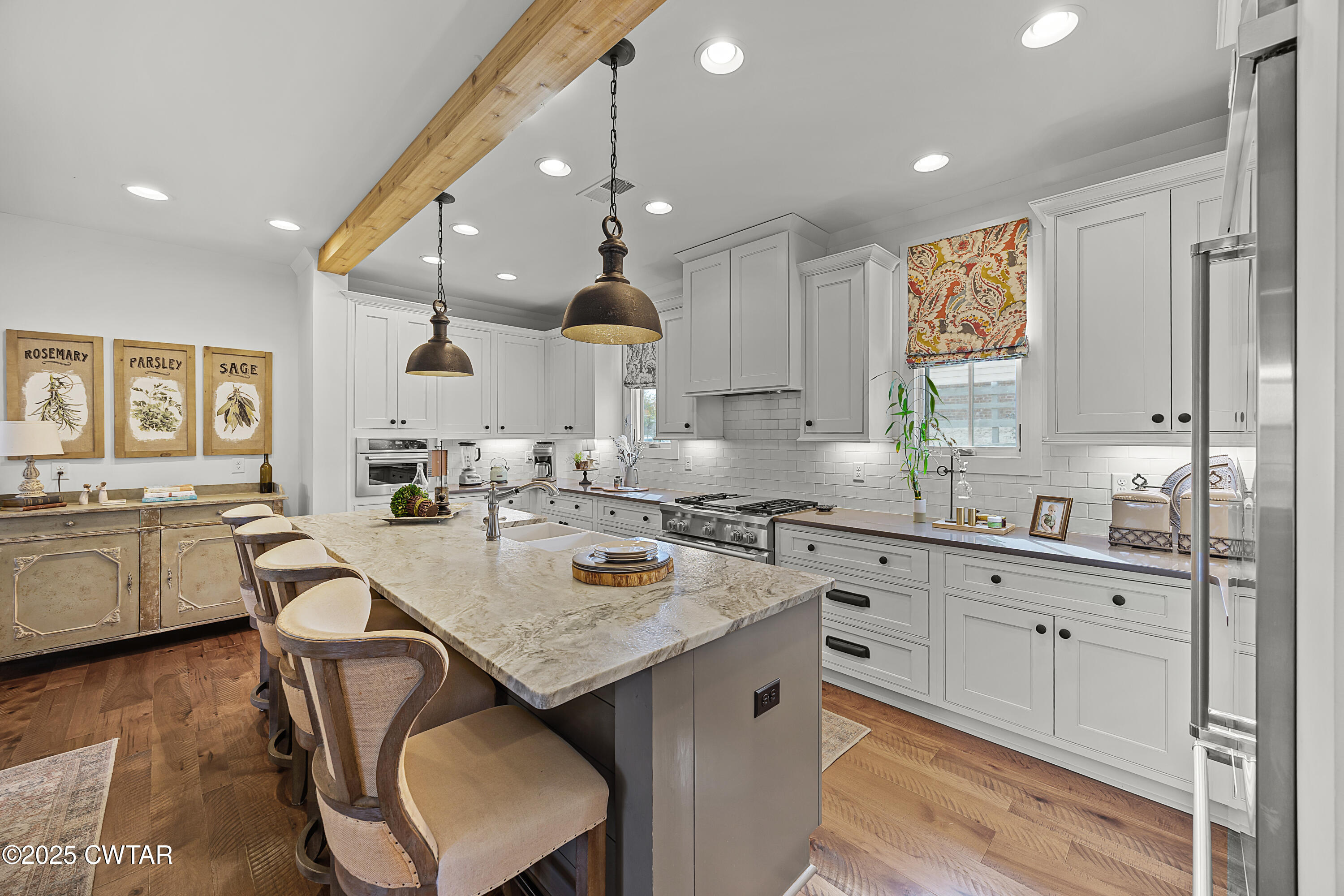 101 Morgan Street Jackson, TN 38301 - Photo 14 of 24 a kitchen with granite countertop a sink stove and cabinets