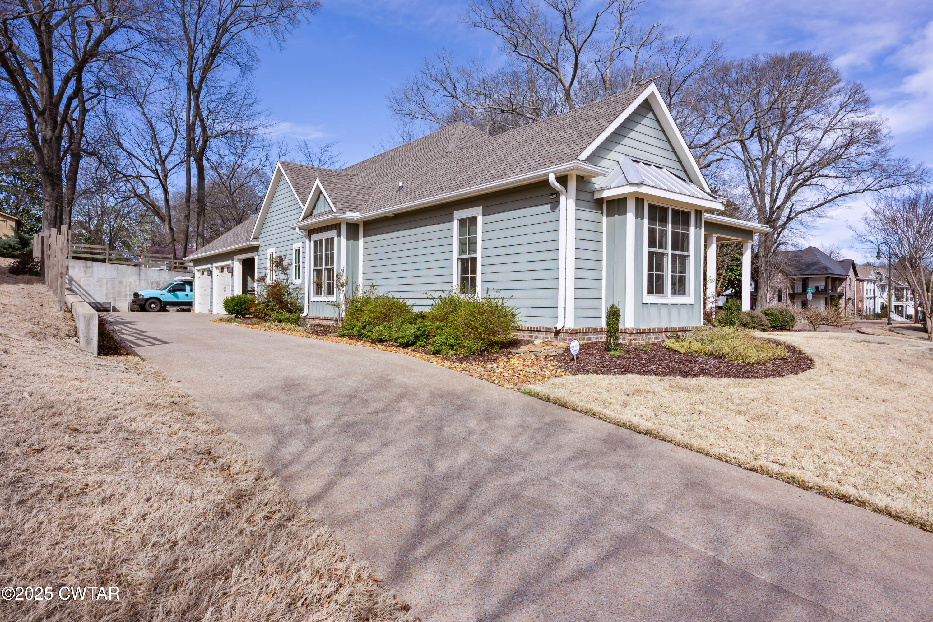 101 Morgan Street Jackson, TN 38301 - Photo 23 of 24 a front view of a house with a yard and garage