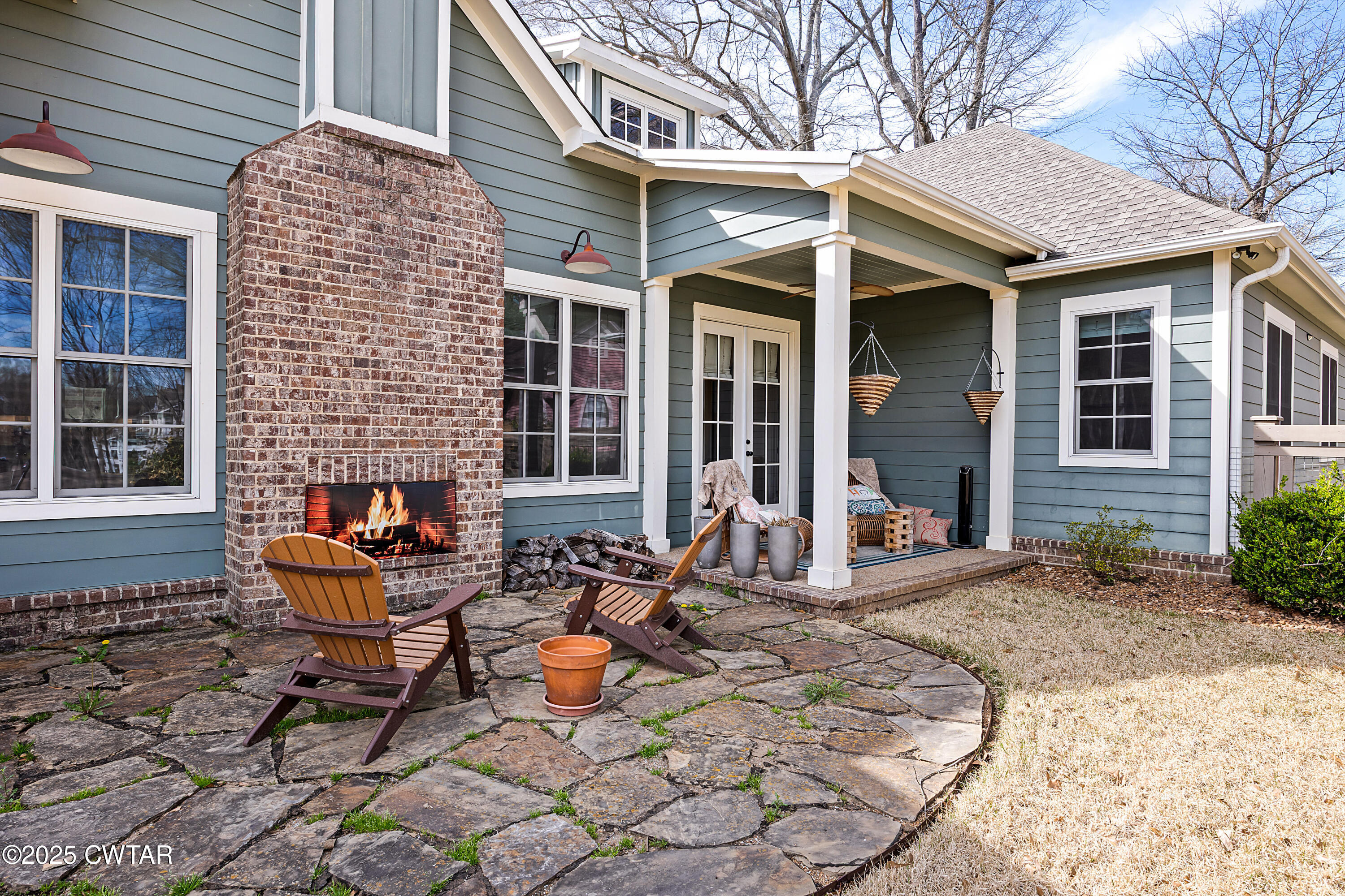 101 Morgan Street Jackson, TN 38301 - Photo 3 of 24 a view of a patio with table and chairs and potted plants