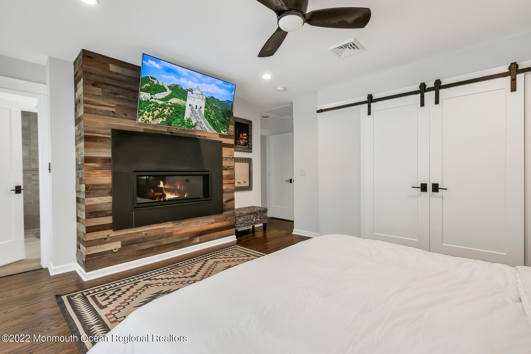 234 Red Hill Road Middletown, NJ 07748 - Photo 15 of 58 a bedroom with a bed and a fireplace