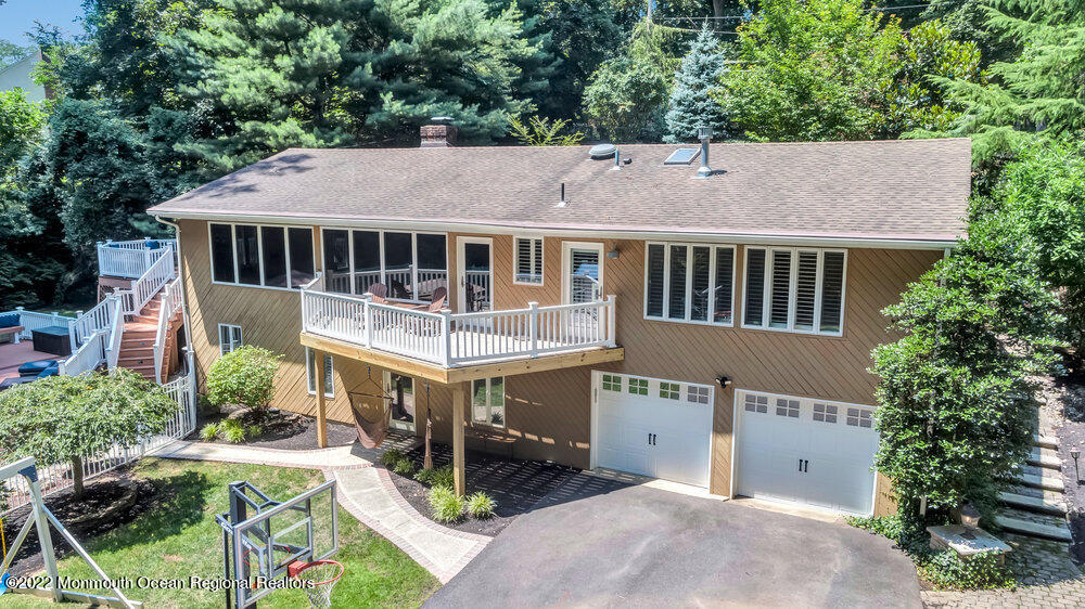 234 Red Hill Road Middletown, NJ 07748 - Photo 2 of 58 an aerial view of a house with a yard balcony and car parked