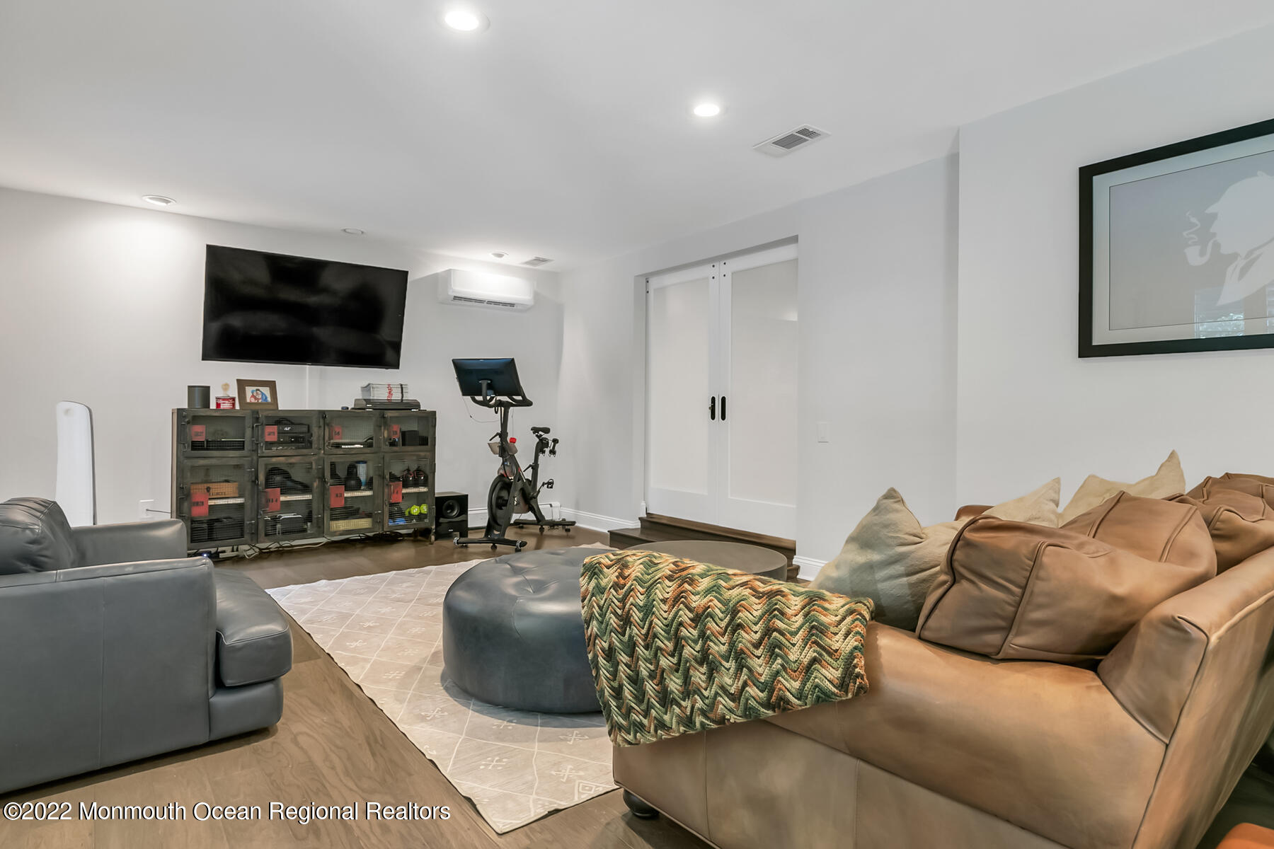 234 Red Hill Road Middletown, NJ 07748 - Photo 27 of 58 a living room with furniture and a flat screen tv