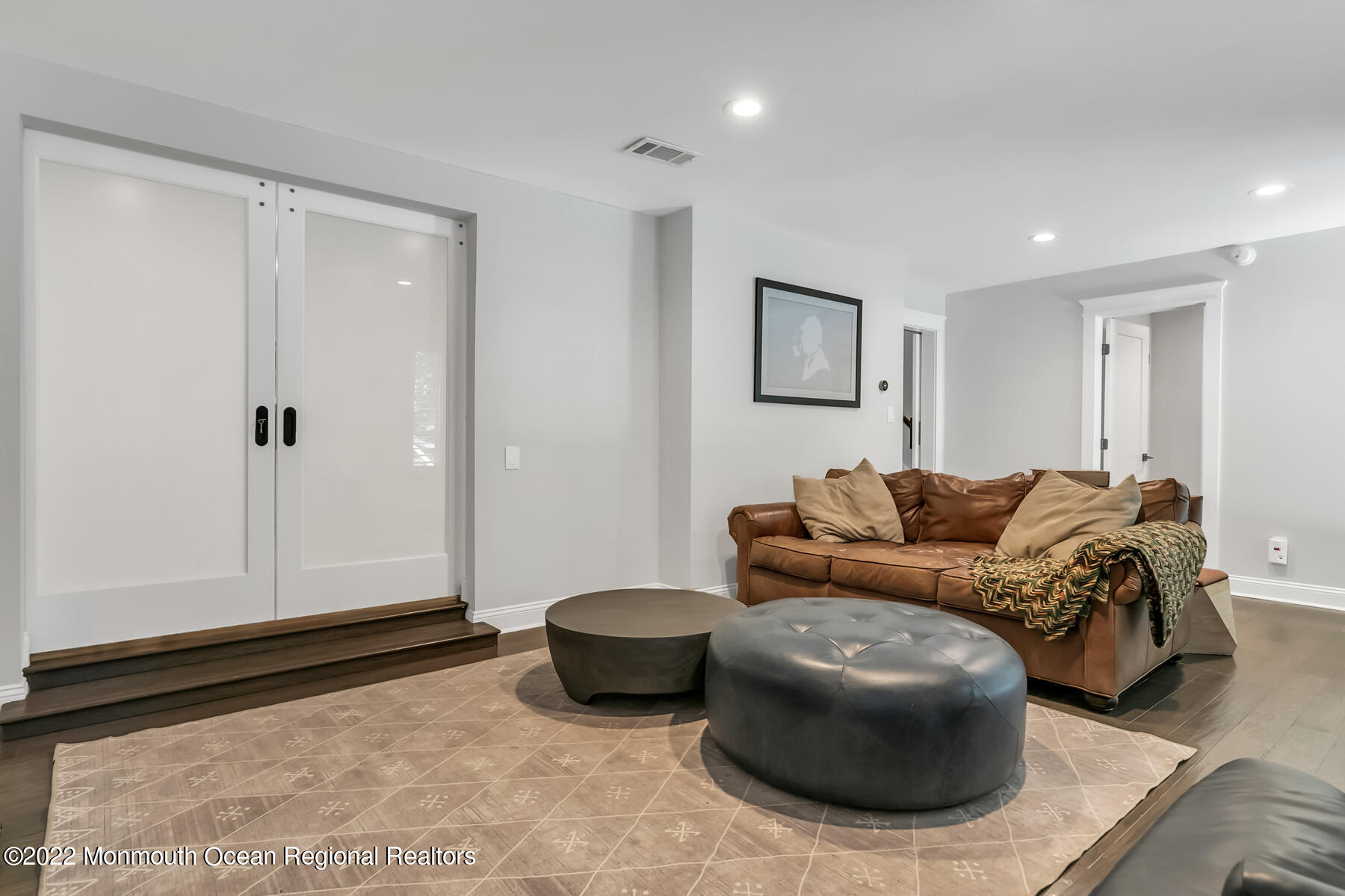 234 Red Hill Road Middletown, NJ 07748 - Photo 28 of 58 a living room with furniture and a rug