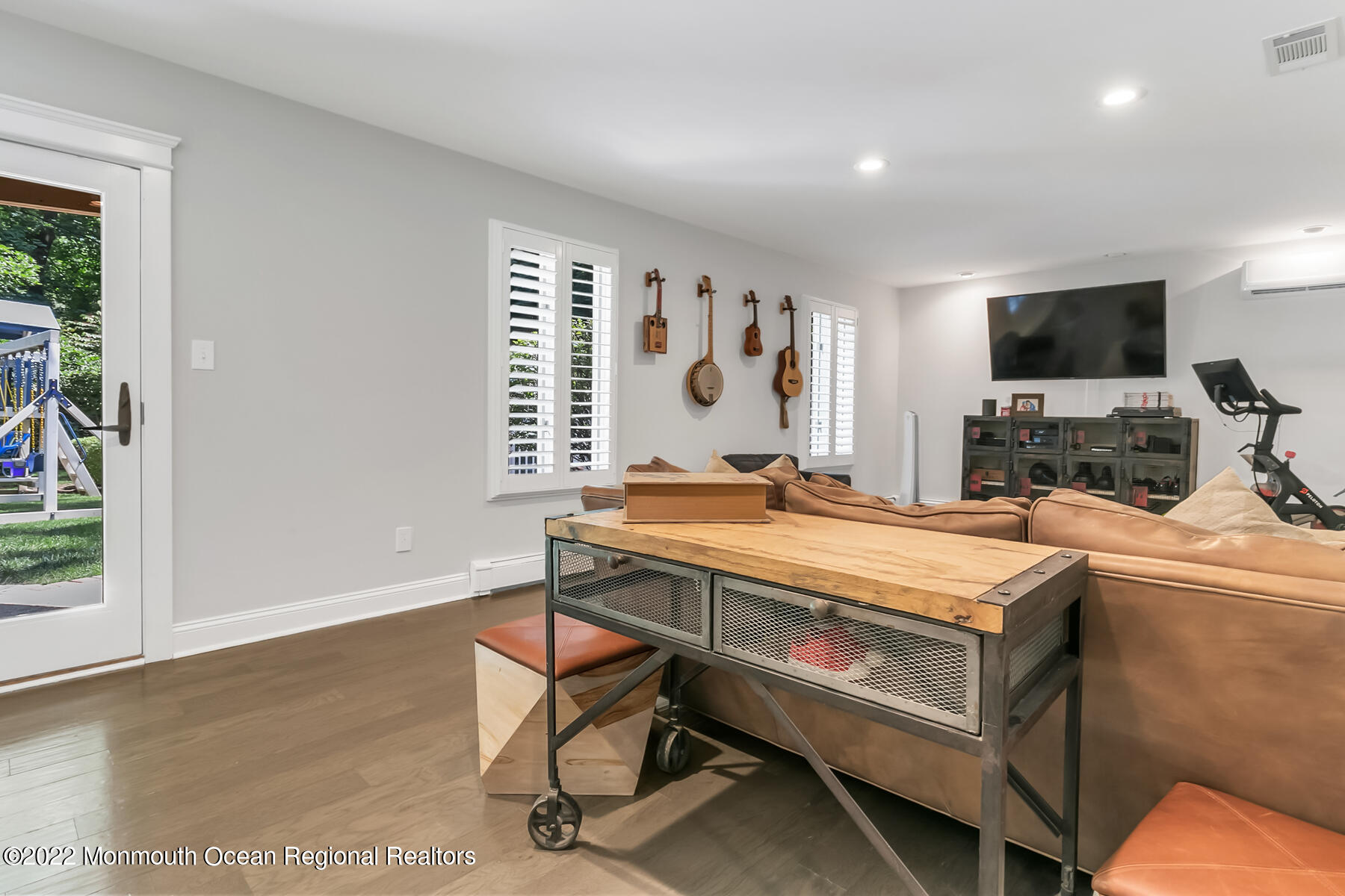 234 Red Hill Road Middletown, NJ 07748 - Photo 29 of 58 a room with furniture and a flat screen tv