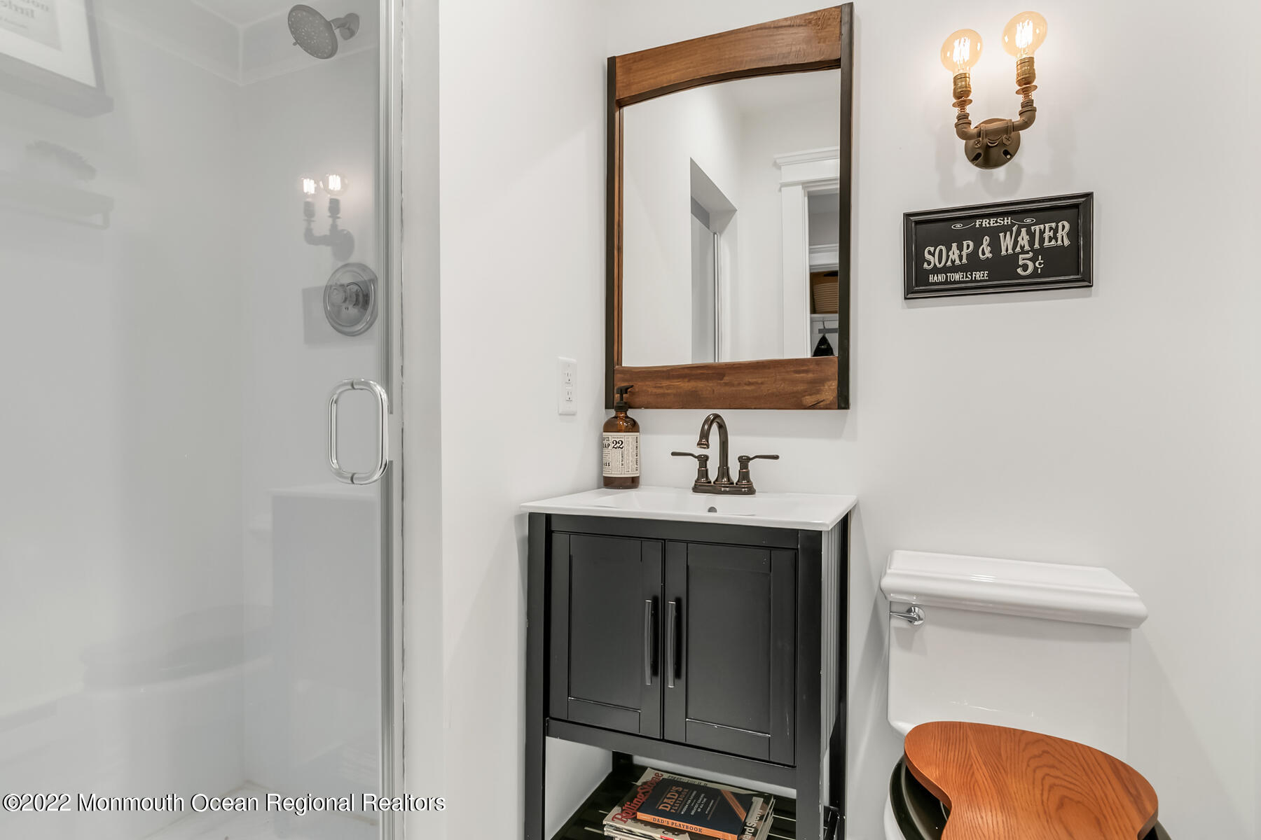 234 Red Hill Road Middletown, NJ 07748 - Photo 30 of 58 a bathroom with a toilet a sink and mirror