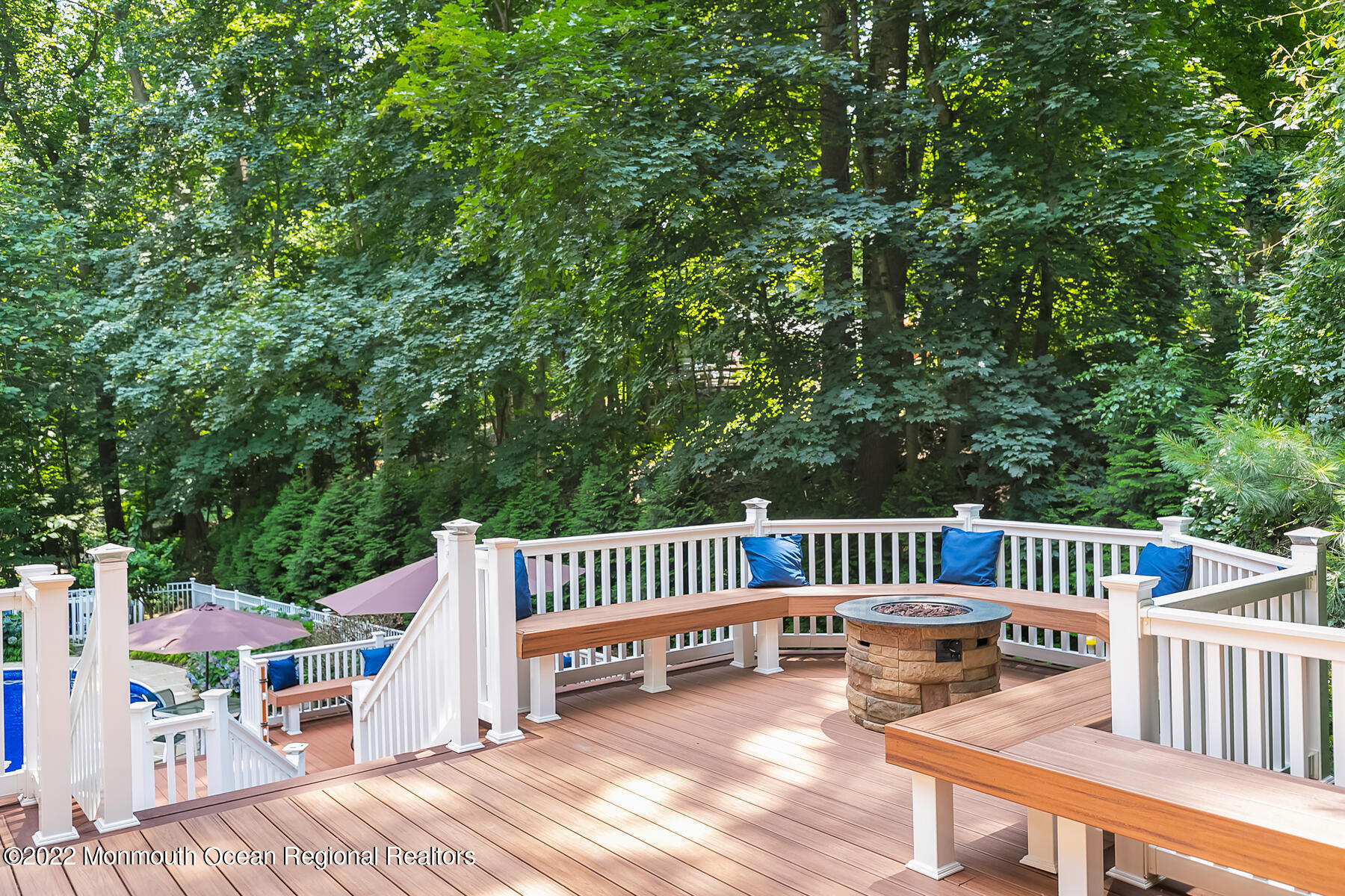 234 Red Hill Road Middletown, NJ 07748 - Photo 37 of 58 a view of a deck with a chair and wooden floor