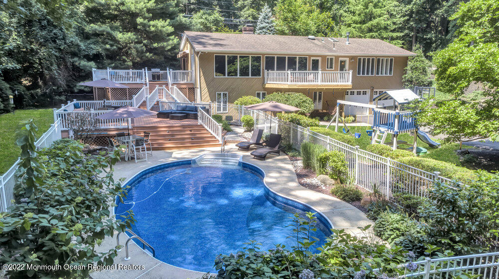 234 Red Hill Road Middletown, NJ 07748 - Photo 52 of 58 an aerial view of a house with swimming pool and large trees