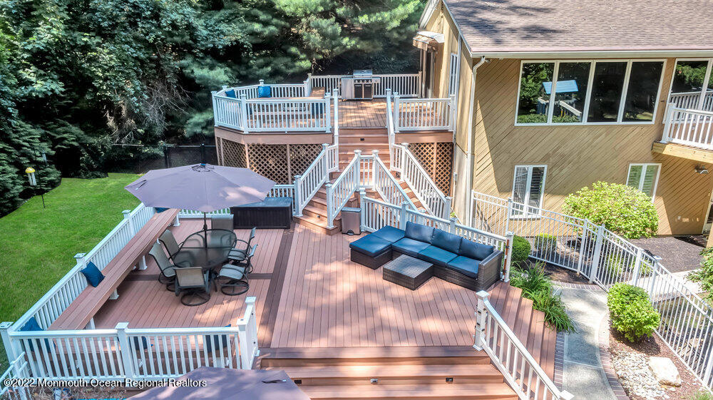 234 Red Hill Road Middletown, NJ 07748 - Photo 53 of 58 a view of a patio with table and chairs potted plants