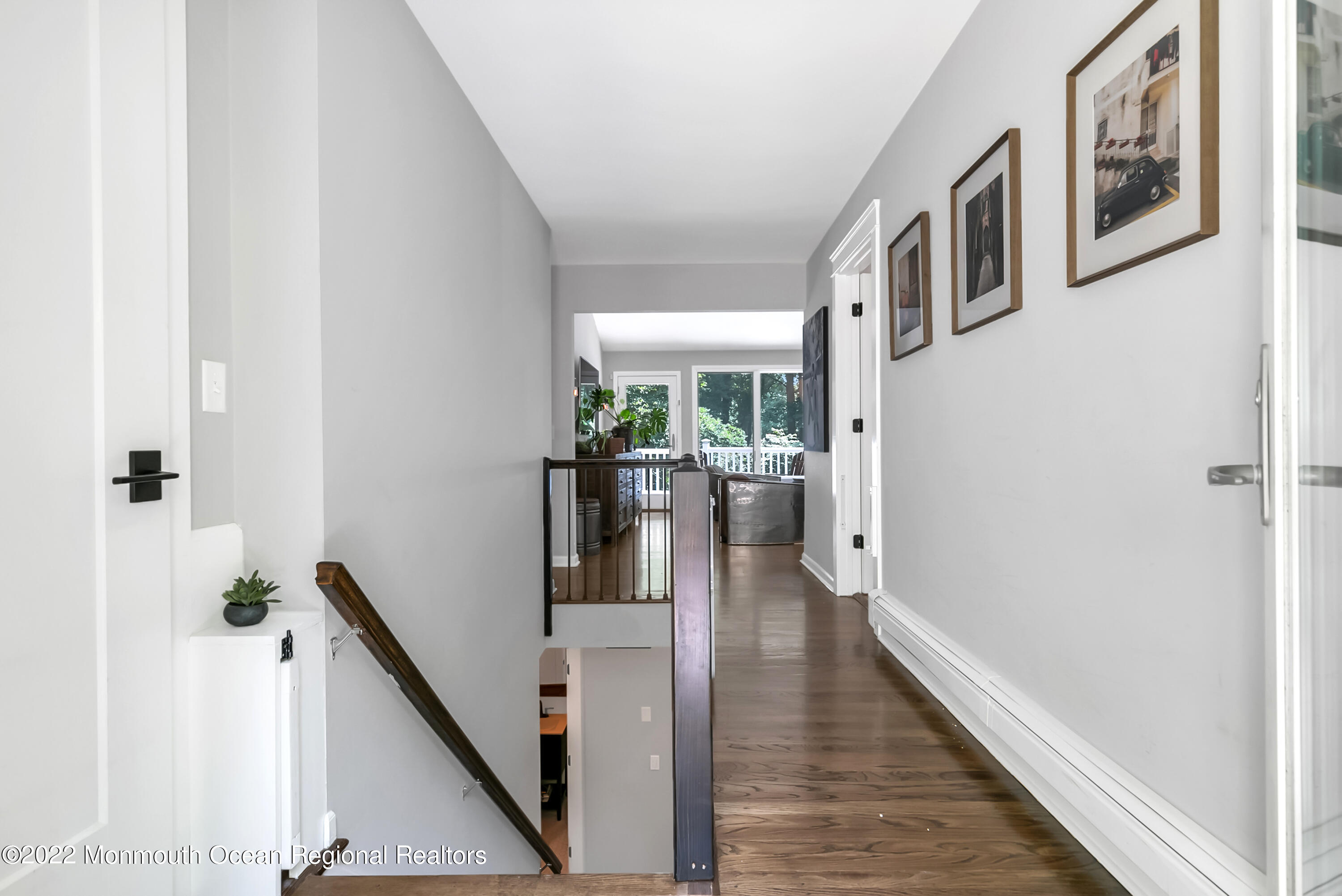 234 Red Hill Road Middletown, NJ 07748 - Photo 7 of 58 a view of a hallway with wooden floor and staircase