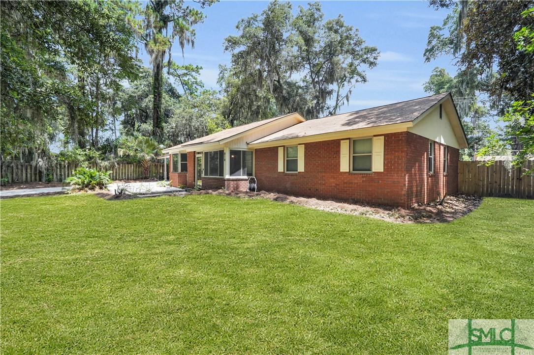 818 Sandtown Road Savannah, GA 31410 - Photo 3 of 37 Grass is digitally enhanced