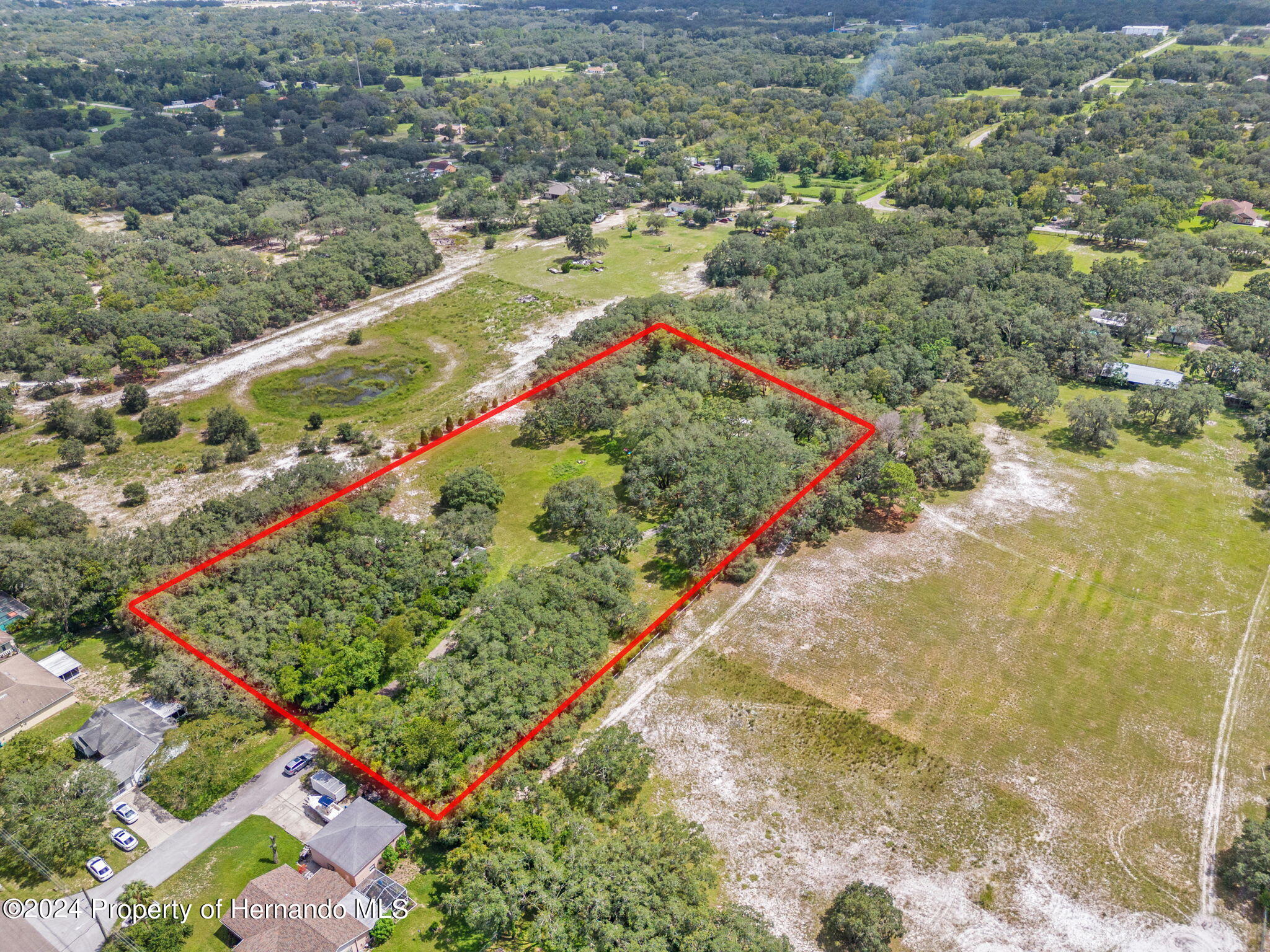 1088 Newcomb Avenue Spring Hill, FL 34608 - Photo 7 of 9 a view of a yard with an umbrella