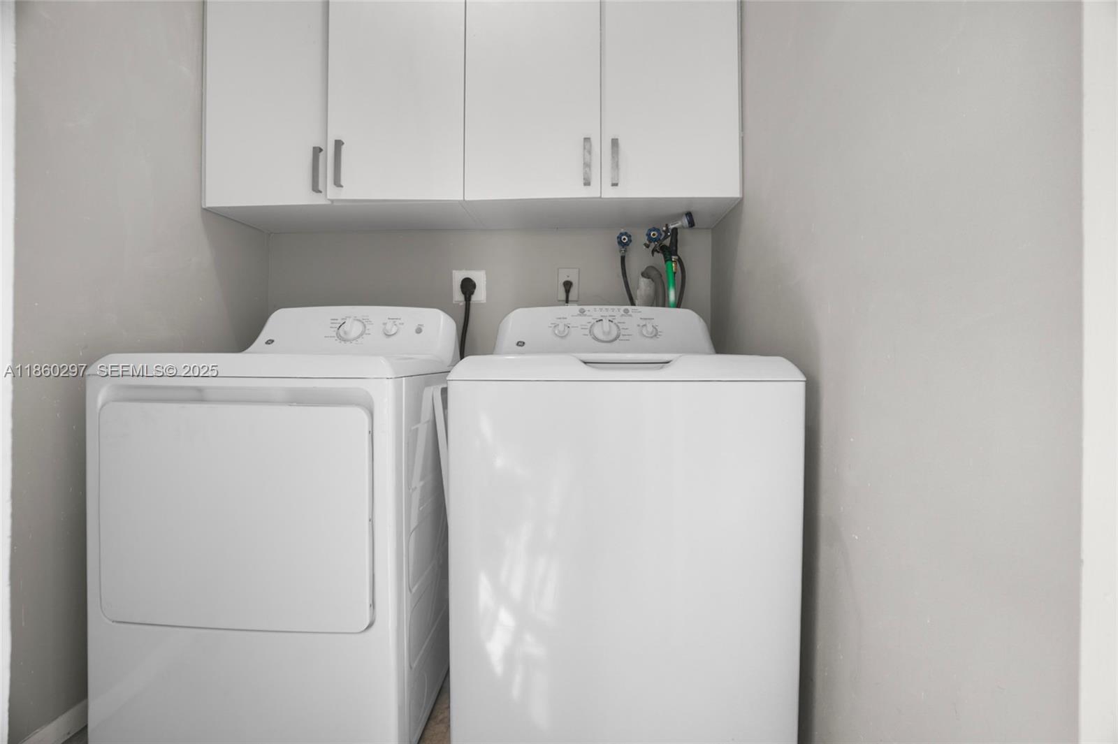 9606 West McNab Road, Unit 202 Tamarac, FL 33321 - Photo 14 of 29 a utility room with dryer and washer