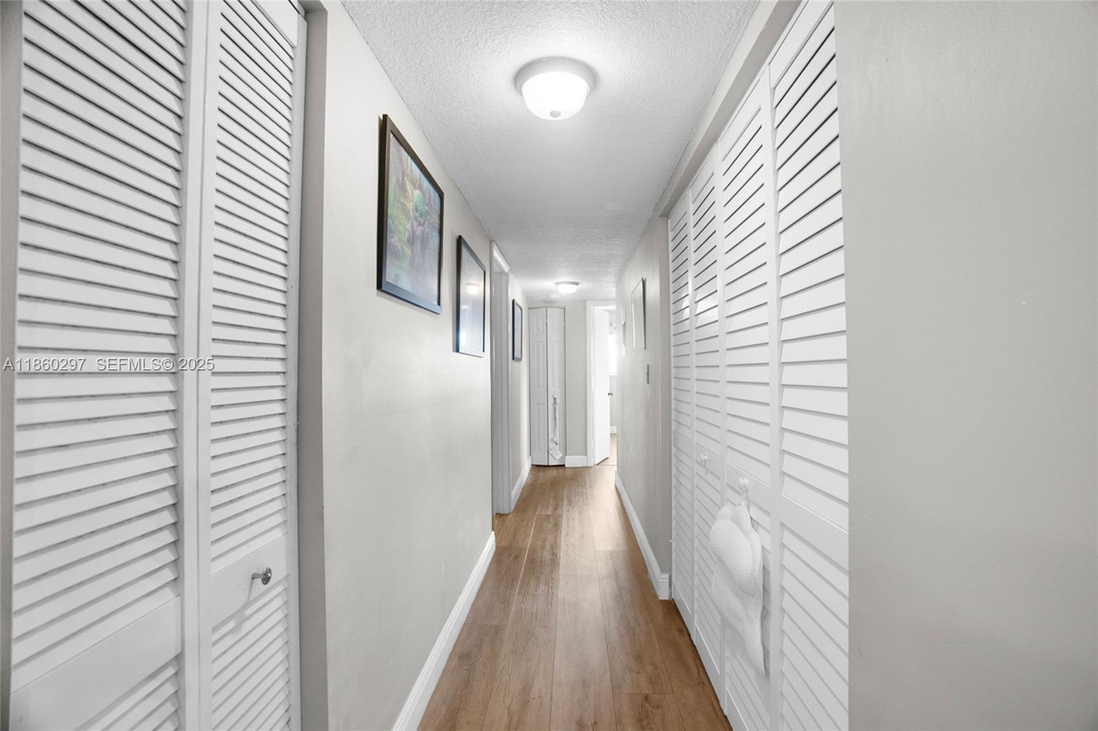 9606 West McNab Road, Unit 202 Tamarac, FL 33321 - Photo 15 of 29 a view of a hallway with wooden floor