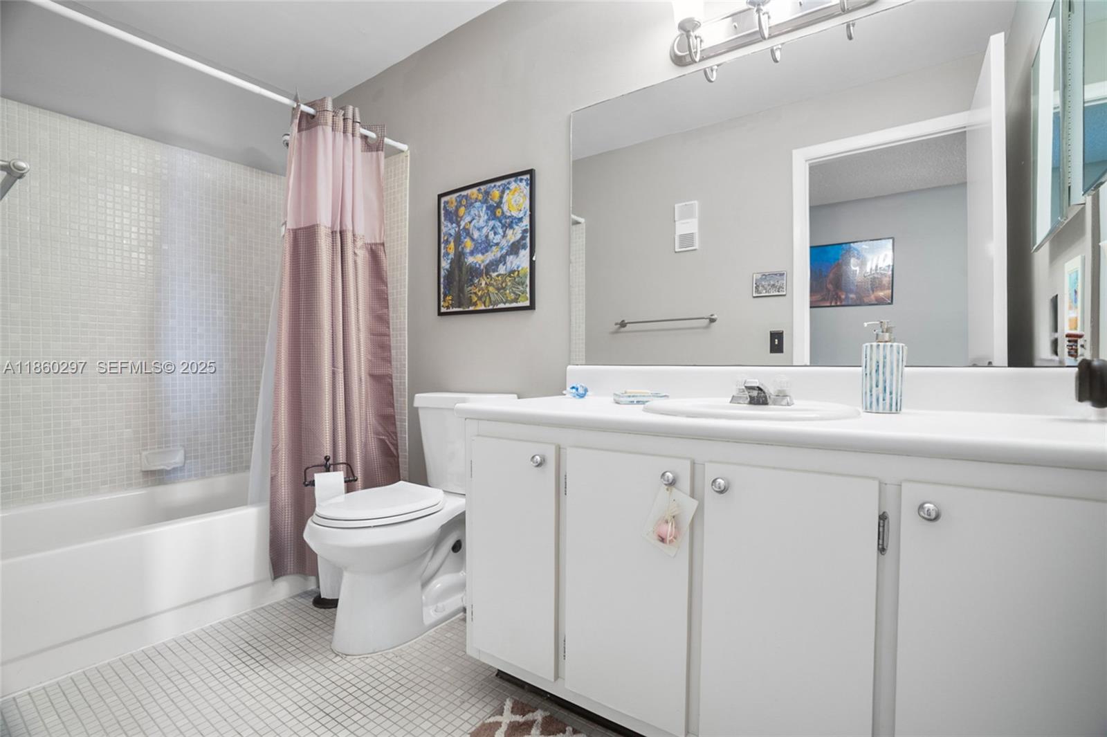 9606 West McNab Road, Unit 202 Tamarac, FL 33321 - Photo 17 of 29 a bathroom with a sink toilet and shower