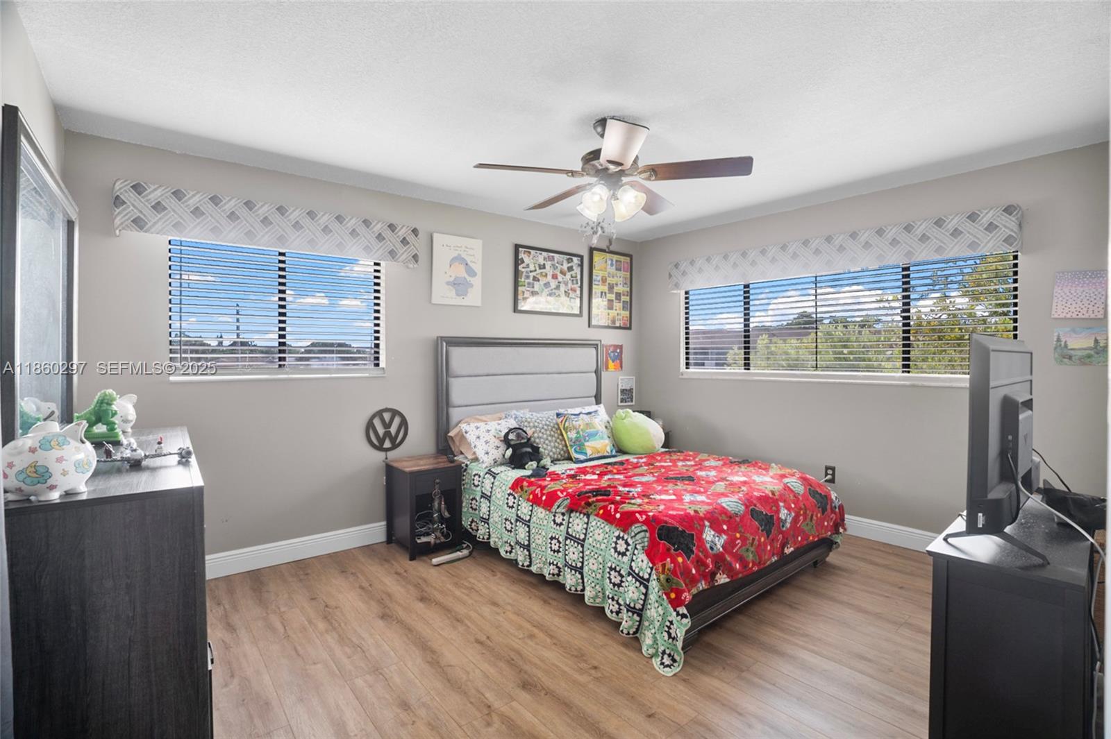 9606 West McNab Road, Unit 202 Tamarac, FL 33321 - Photo 18 of 29 a bedroom with a bed and a window