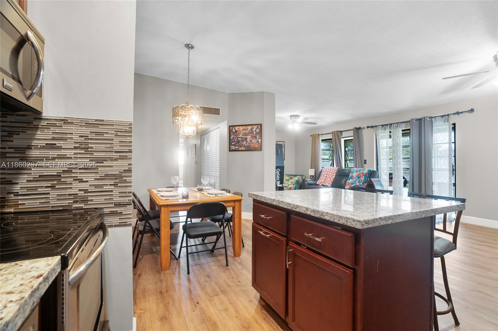 9606 West McNab Road, Unit 202 Tamarac, FL 33321 - Photo 2 of 29 a kitchen with stainless steel appliances granite countertop a sink stove and cabinets