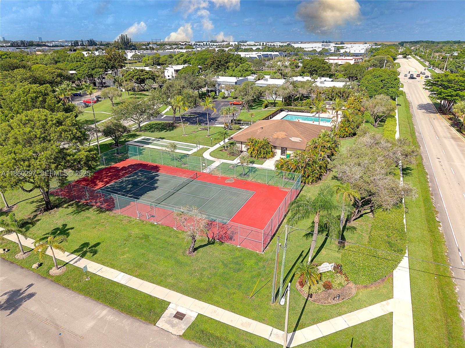 9606 West McNab Road, Unit 202 Tamarac, FL 33321 - Photo 26 of 29 an aerial view of residential houses with outdoor space